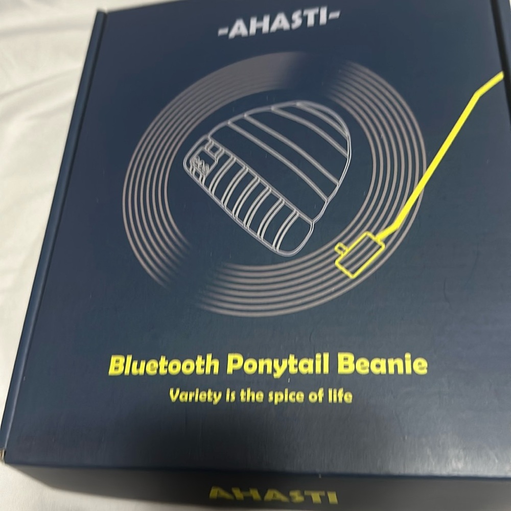 Ahasti Bluetooth ponytail beanie. Never been opened or used.